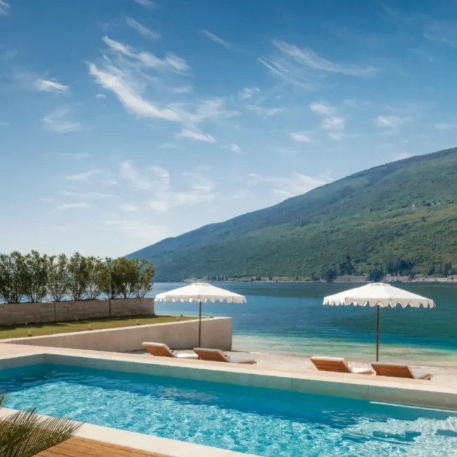 Spacious family-friendly villa for sale in Tivat, Montenegro, surrounded by lush greenery and mountain views.